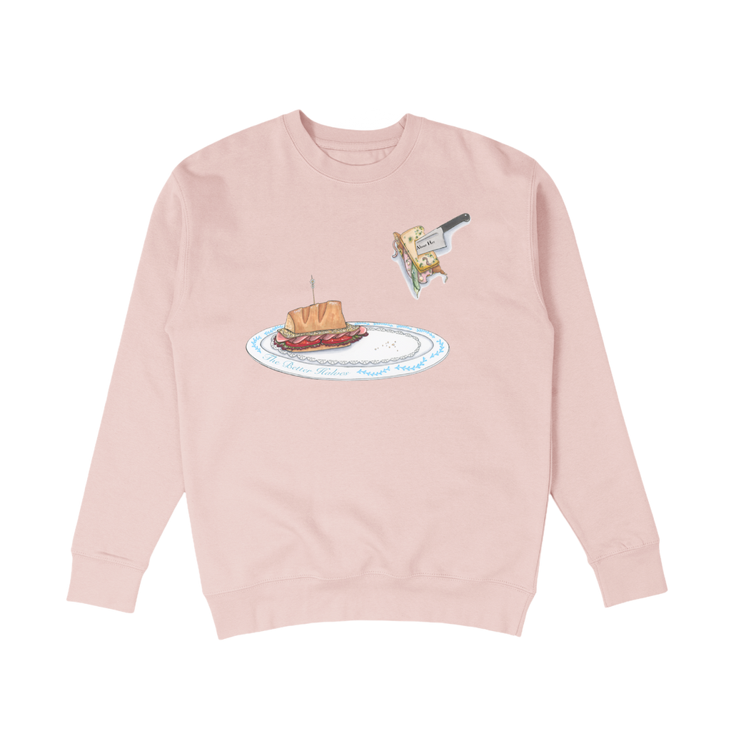 A pink crewneck with a design of a sandwich on a plate printed across the center chest